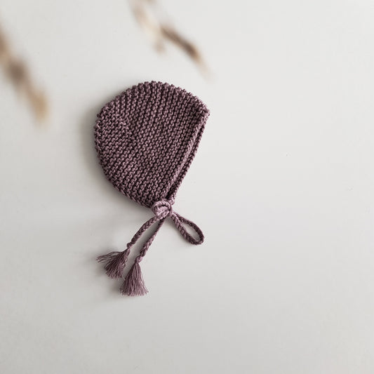 Knitted bonnet for baby doll, mauve