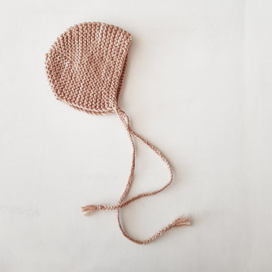 Knitted bonnet, pale pink